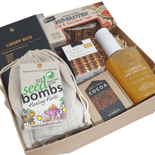 Gift box with nuts, crackers, chutney, west coast cocoa, tumeric and healing herb seed bombs